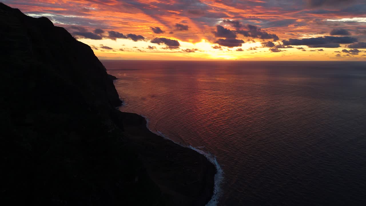 Captivating drone panorama of Ponta da Ladeira cliffs of Madeira, breathtaking coastline stretching into the horizon softly glowing at sunrise