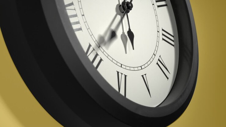 Latin Clock Face on Yellow Wall in Time Lapse