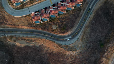 Downward-angle-drone-shot-of-the-roads-in-Cabo-Lucas-Mexico-with-resort-villas