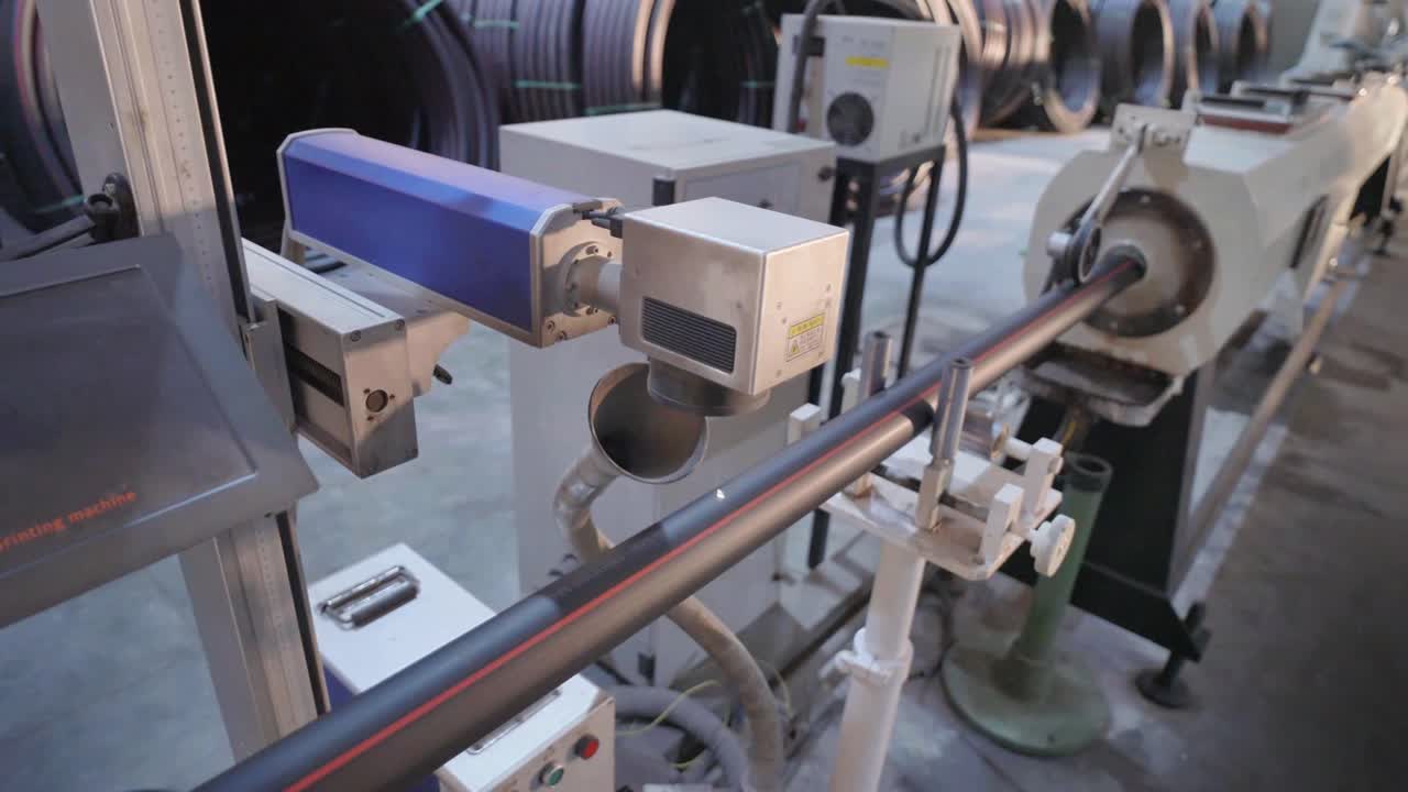 Automation in a Karachi factory using laser technology to inspect PVC pipes.