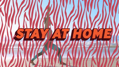 animation of orange words stay at home over caucasian woman exercising on a beach