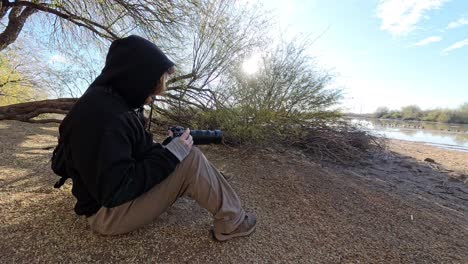 hobby photographer taking pictures in gilbert arizona riparian preserve.