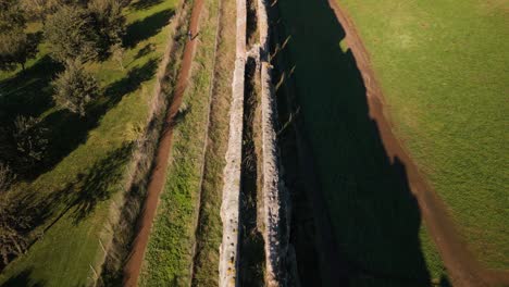 aerial view of passage at top of ancient roman aqueduct to transport water