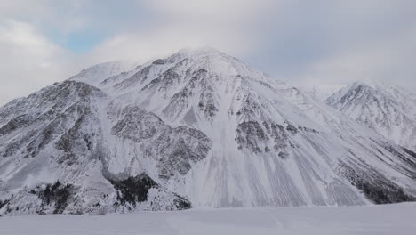mountains covered with snow during winter in kathleen lake in yukon, canada. aerial shot