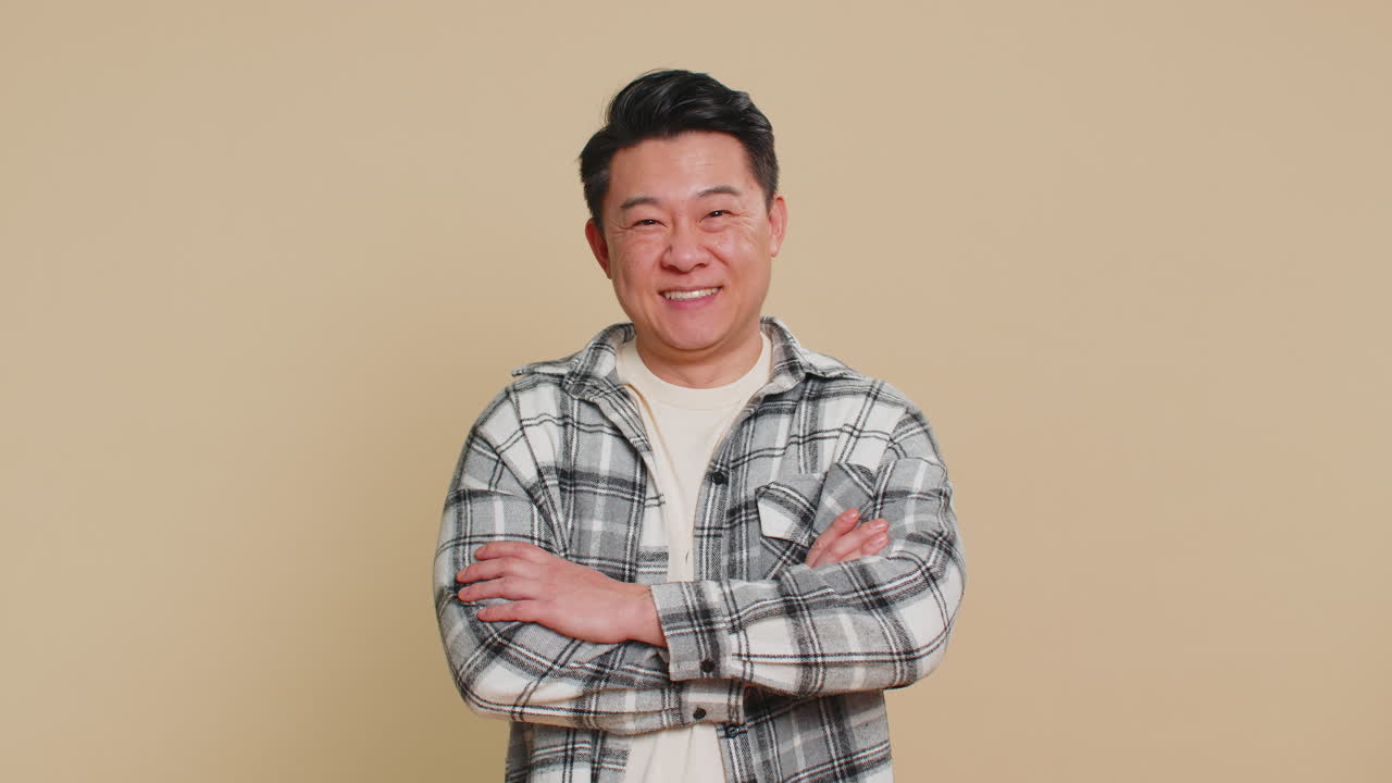 Happy asian man smiling friendly glad expression feel satisfied concept good news celebrate win