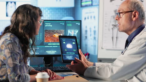 vertical video meeting between doctor and patient to examine mri scan showing a tumor