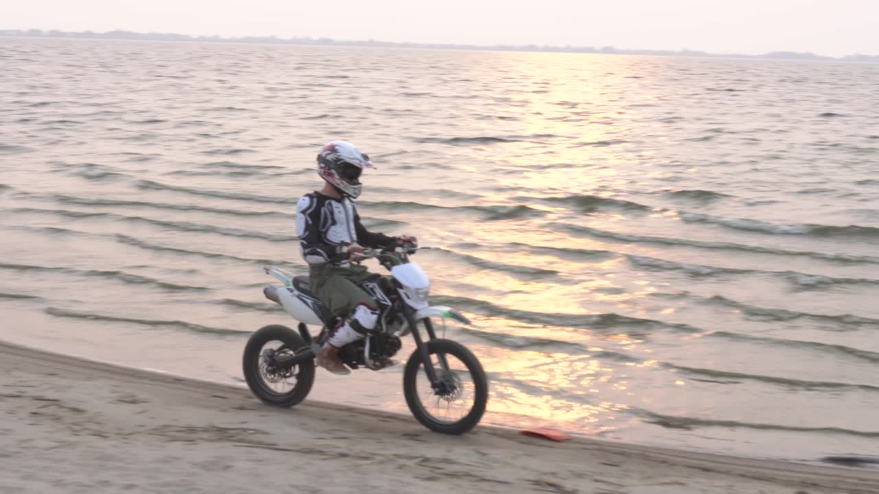 Motocross Rider on Beach at Sunset