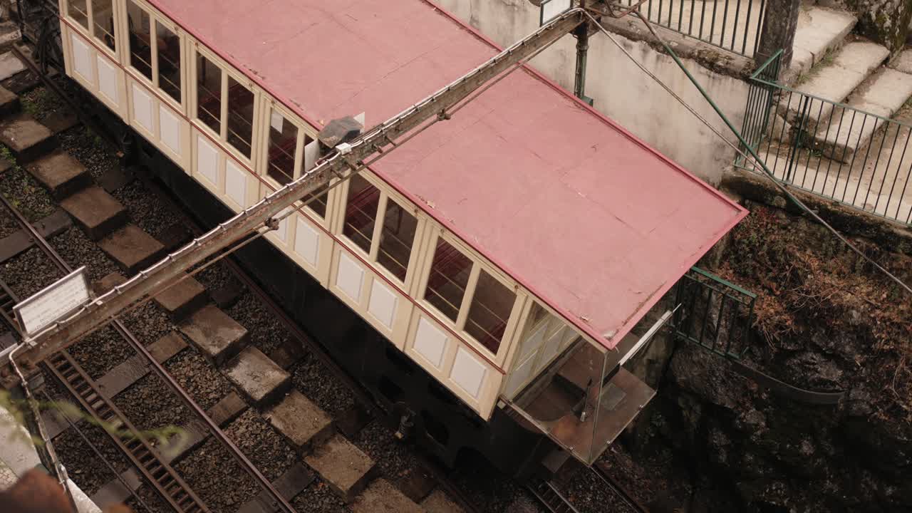 vintage funicular train moves downhill at Bom Jesus do Monte sanctuary