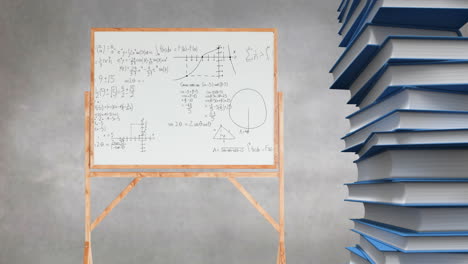 pila de libros y ecuaciones matemáticas y gráficos escritos en una tabla blanca