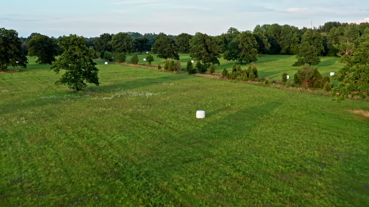Aerial View of Beautiful Field and Bales of Straw in Saaremaa Estonia - Dolly Shot
