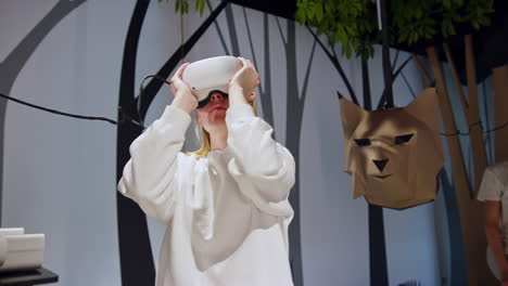 girl and a boy wearing vr headsets, making head and arms movements, medium shot