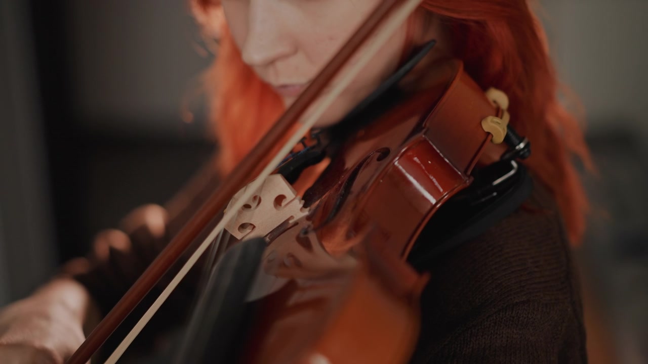 Caucasian violin coach demonstrating bow technique closeup, detailed views of hand grip and motion, posture adjustment and finger placement, steady rhythm emphasis, instructional school atmosphere