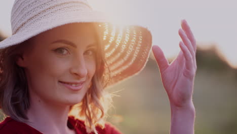 beautiful woman posing into camera and smile at golden sunset 1