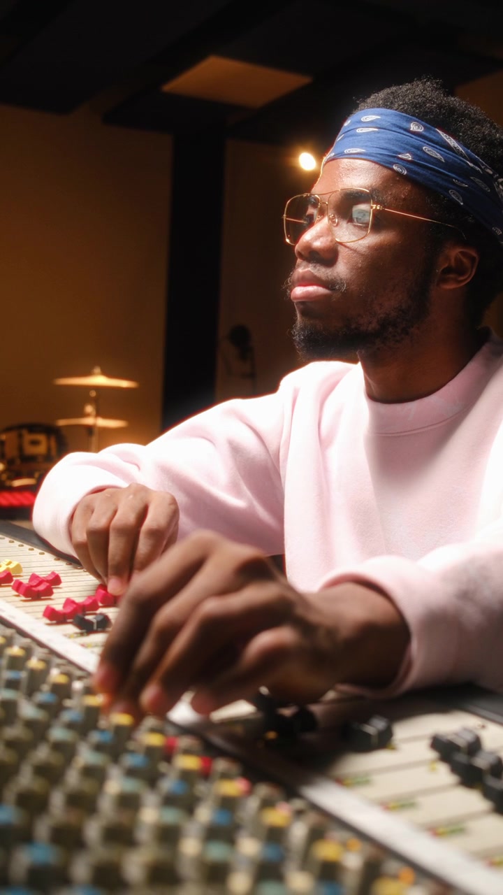 Black Sound Technician Mastering Track in Audio Recording Studio