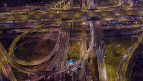 aerial hyperlapse of traffic over big intersection bridges and ring road. 4k aerial view by a drone over big roundabout in bangkok thailand.