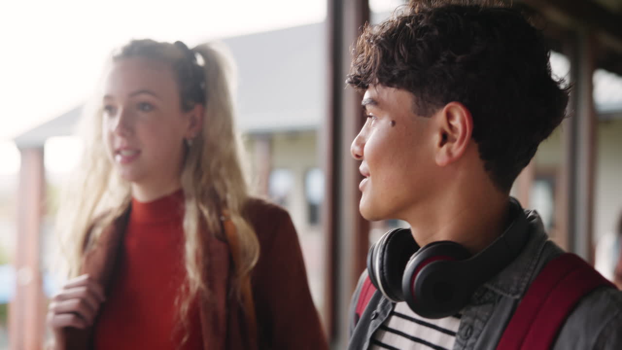 Students walking in school hallway