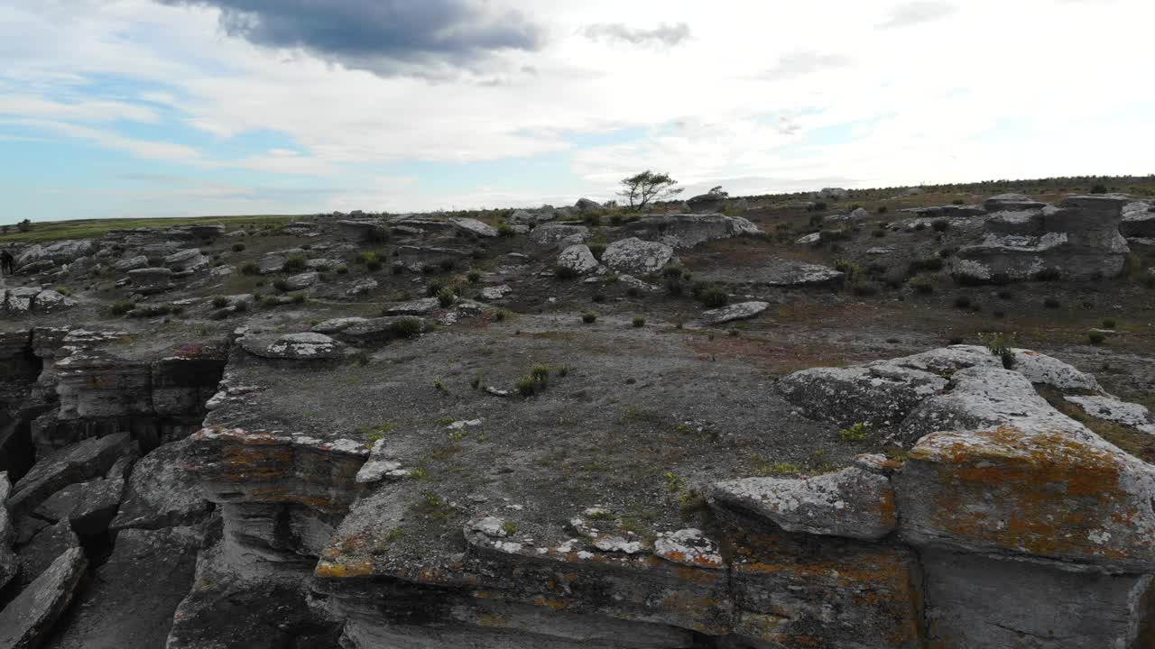 Drone pull back over rocky cliff edge, Asunden Raukfield, Sweden
