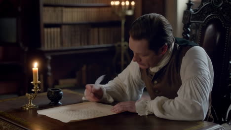 man writing with a quill and ink in a historical study