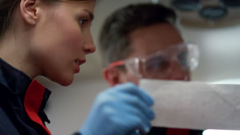 medical workers analyzing patient heartbeat