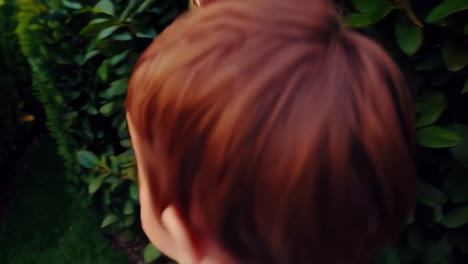child in a rose garden