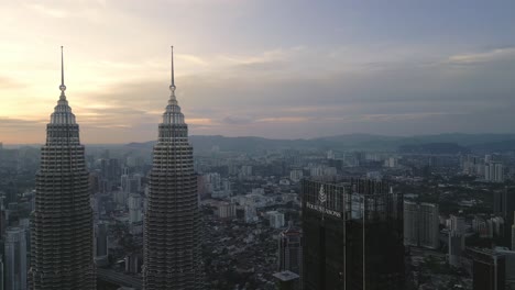aerial sunset panoramic view of kuala lumpur malaysian city center, klcc, petronas twin towers