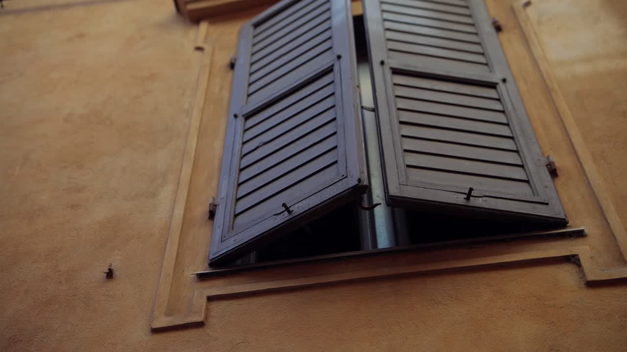 Italian Building with Brown Shutters