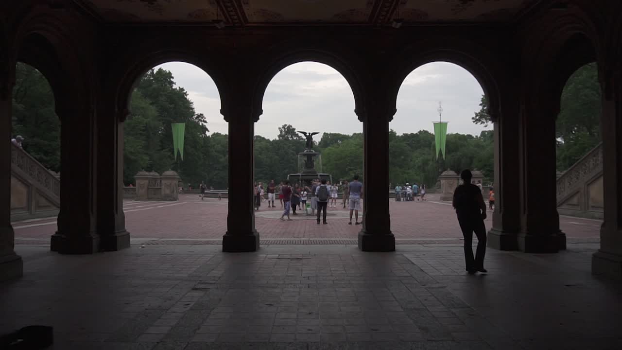 Reveal of Bethesda Fountain in Central Park. This footage shows people exploring the area.