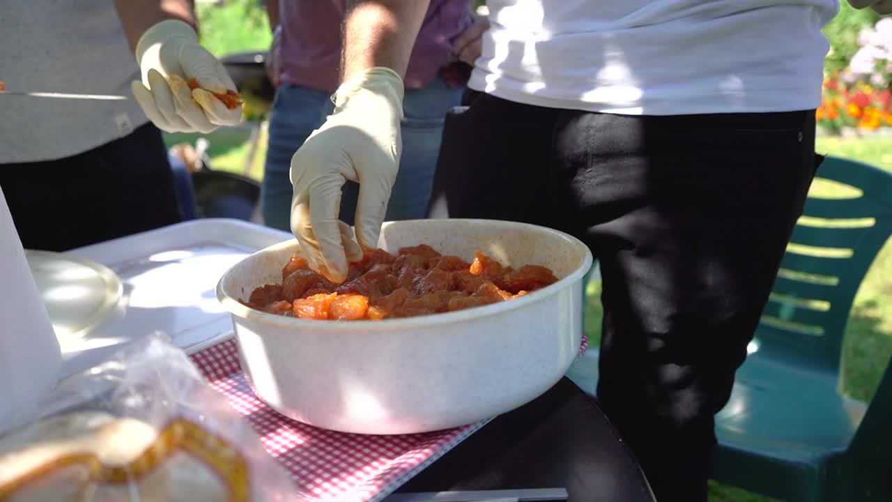 preparing chicken to grill for a bbq