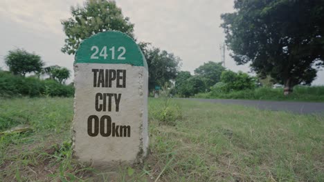 highway milestone showing distance of taipei city