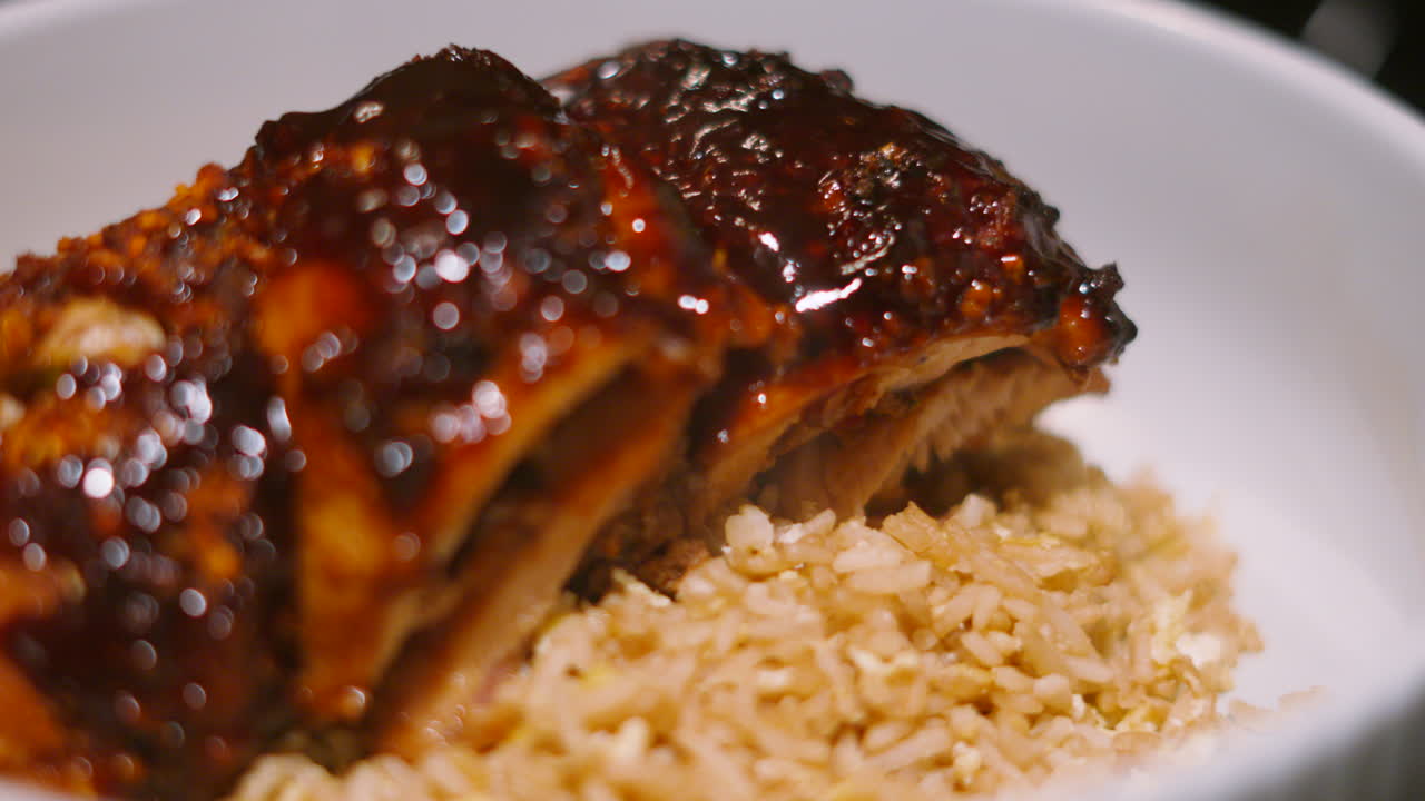 Panning View of Japan Teriyaki Miso Chicken King Kebab Resting on Bed of Egg Fried Rice with Delicious Sticky Glaze Across the Top. Japanese Cuisine 4K.