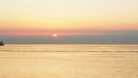 transportation-boats-out-in-the-ocean-during-sunset