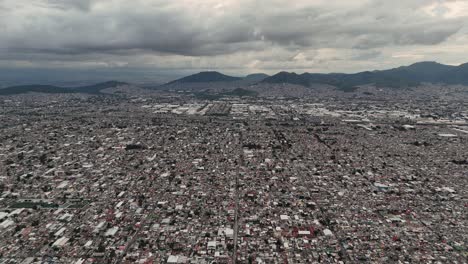 Ecatepec Valley, blanketed in clouds, captured from above during the rainy season