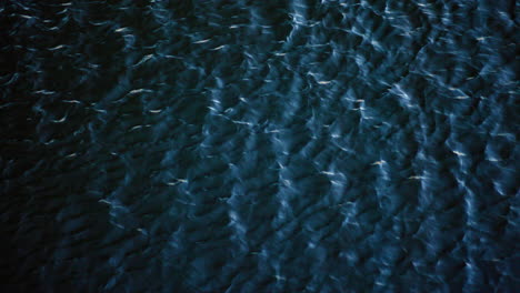 wind blowing ripples across the water