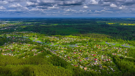 drone hyperlapse of jelgava city with meandering svete river and moving clouds from above