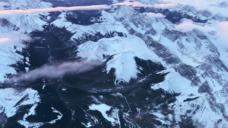 warm light illuminates canada's rocky mountain range