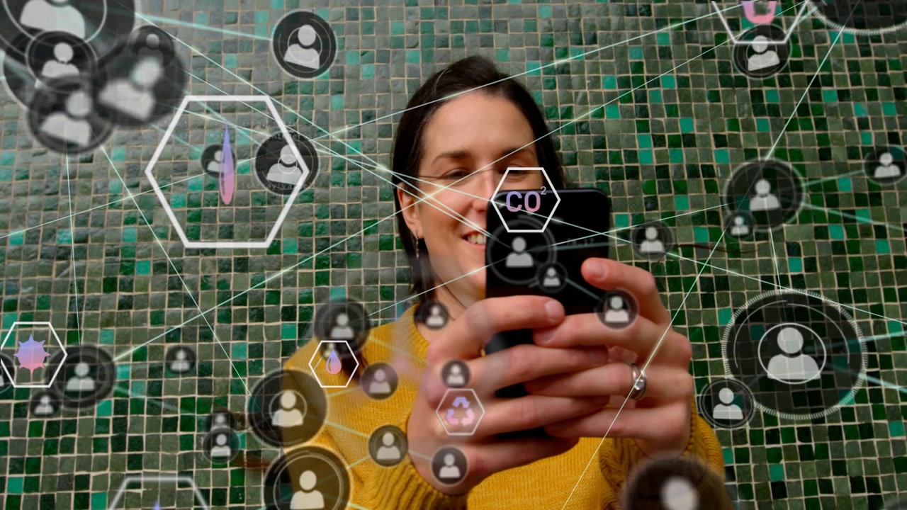 Mid-adult woman tapping smartphone and scrolling, activating AR network overlaying social data