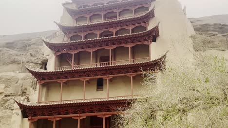 the mogao caves, thousand buddha grottoes in dunhuang, an oasis located on the silk road, in gansu province, china tilt up view