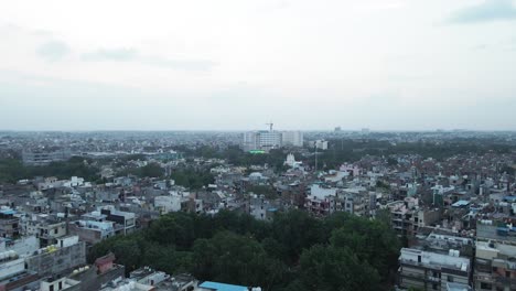 4K-Aerial-Shots-of-New-Delhi-Residential-Suburbs-on-a-beautiful-day-gliding-over-Rooftops,-streets,-parks-and-markets-in-India