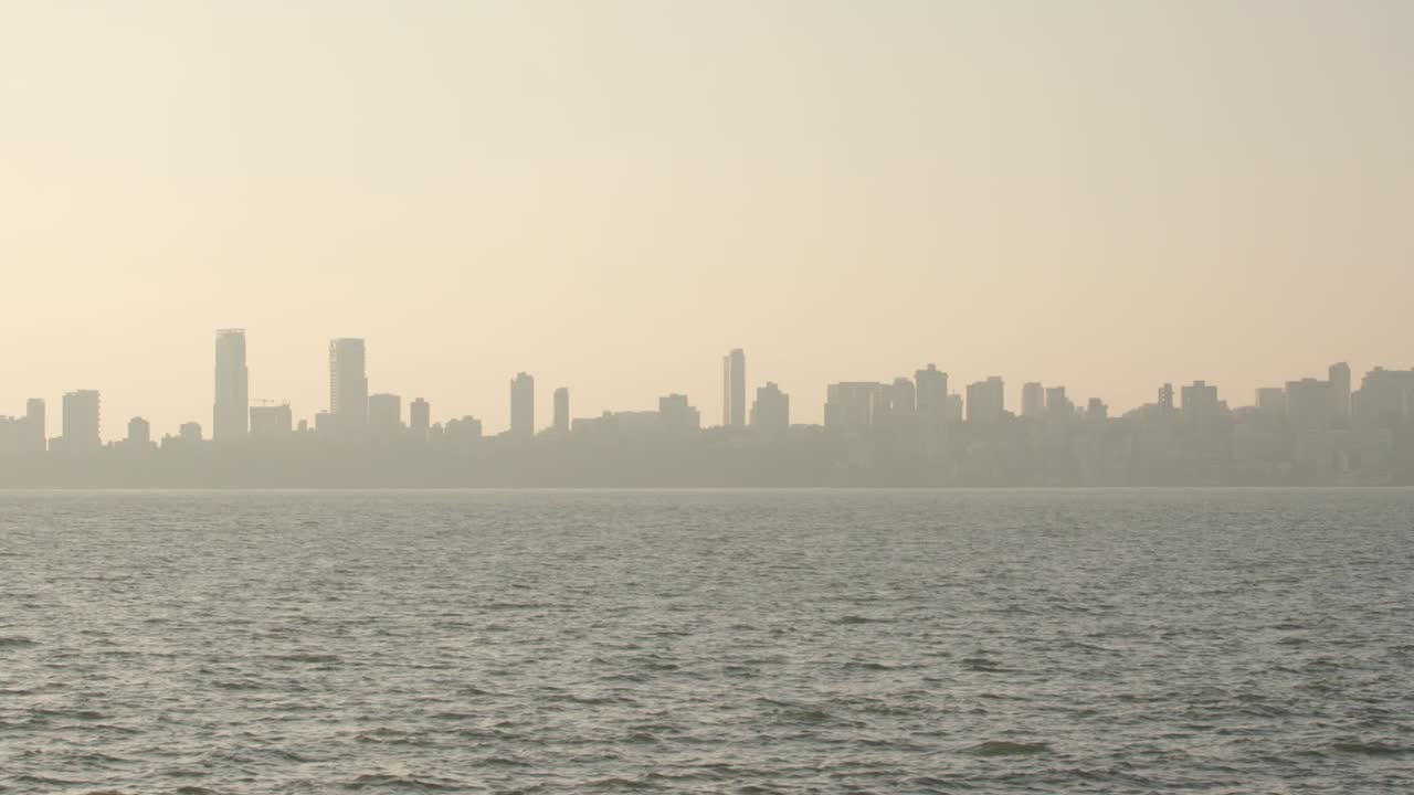 The silhouette of Mumbai's skyscrapers as the sun sets