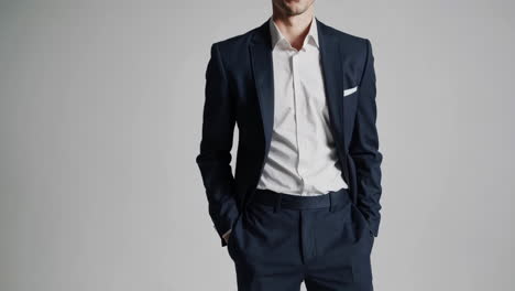 man in a dark suit and white shirt