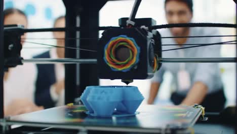 an innovative 3d printing process capturing the attention of enthusiastic observers, showcasing the modern technology used to create intricate designs with precision