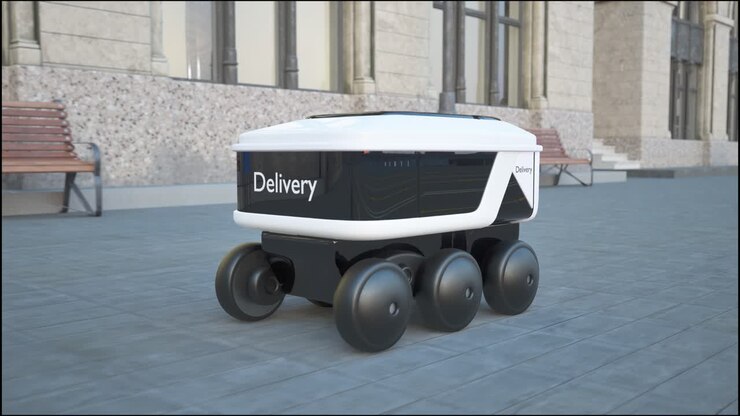 Automated Delivery Robot Service Driving On Urban Street. Modern Smart Wireless Robot Delivers Goods Or Food To A Customer. New Technological Iot Business Industry Of Delivery Logistic Of Online Shop