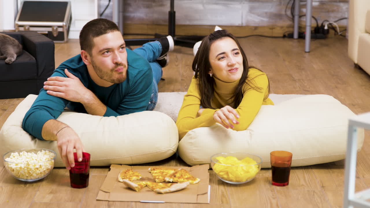 Couple Enjoying Snacks Together at Home