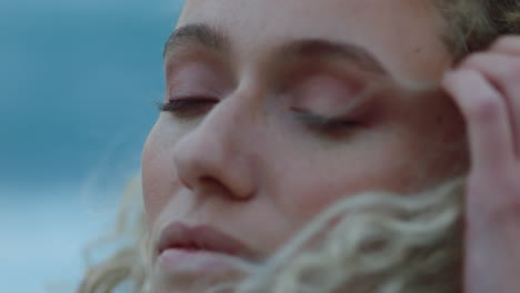 close-up-portrait-of-beautiful-woman-peaceful-contemplating-journey-exploring-spirituality-feeling-freedom-with-wind-blowing-hair