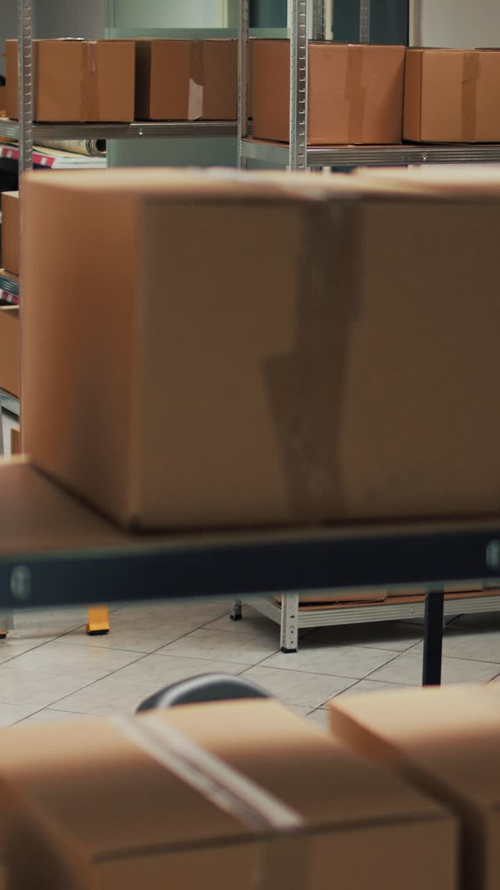 Vertical video: Empty storage room filled with many cardboard boxes on racks