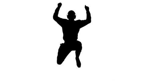 silhouette of a man enjoying music and jumping on white background