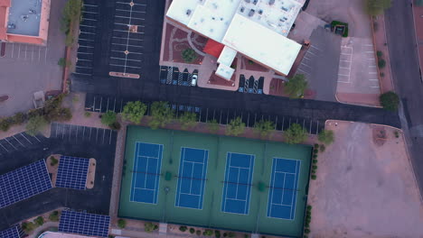 top view of empty tennis courts in a recreational facility during pandemic