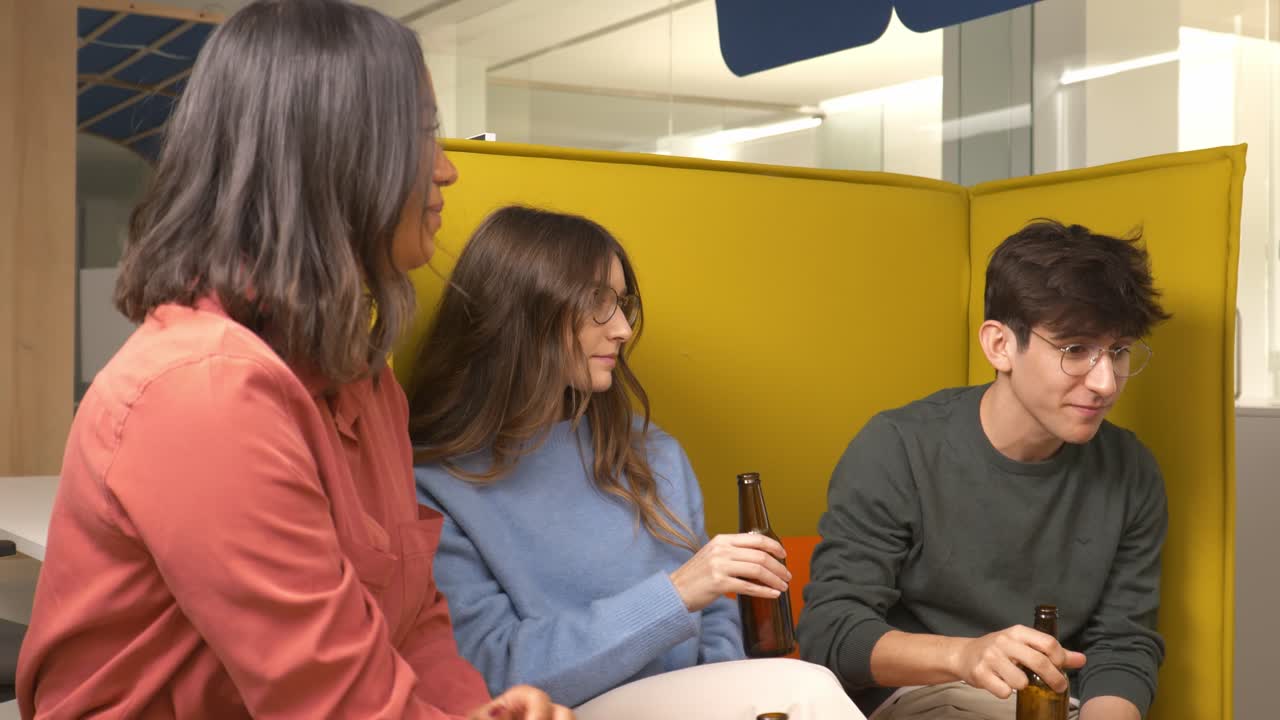 Coworkers drinking beer and enjoying break time