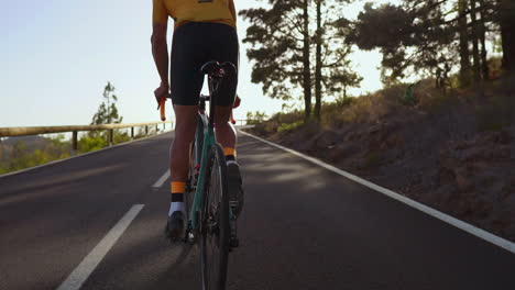 man cycling on road bike outdoor exercise on an empty road in the morning .extreme sport concept. slow motion