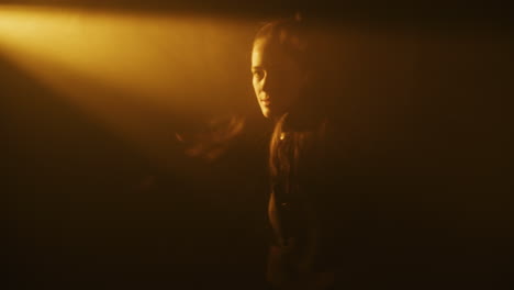 mysterious woman in spotlight